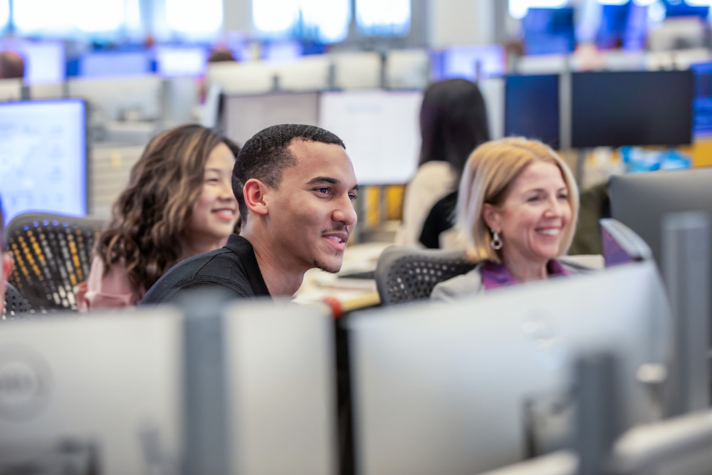 Three employees working in an office.