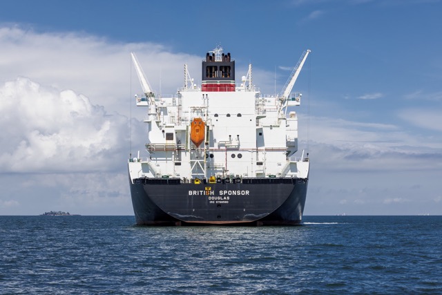 Front view of a cargo ship at sea.