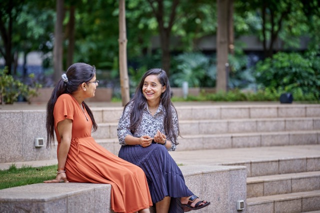 bp interns outdoors on campus steps, highlighting career development, learning, and internship opportunities.