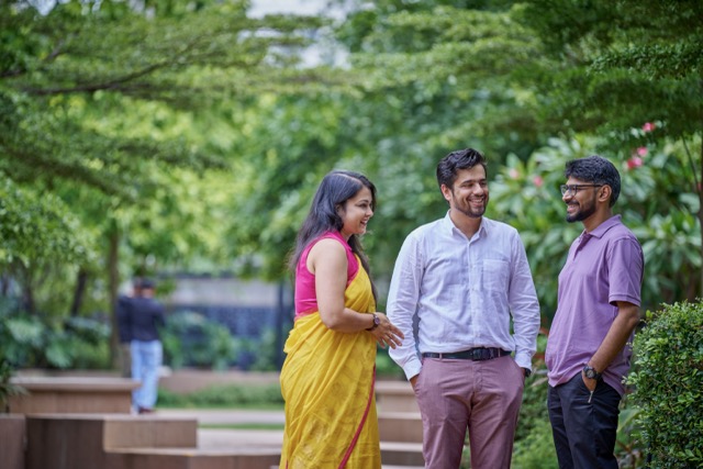 bp employees outdoors talking together, highlighting diversity, collaboration, and workplace culture.
