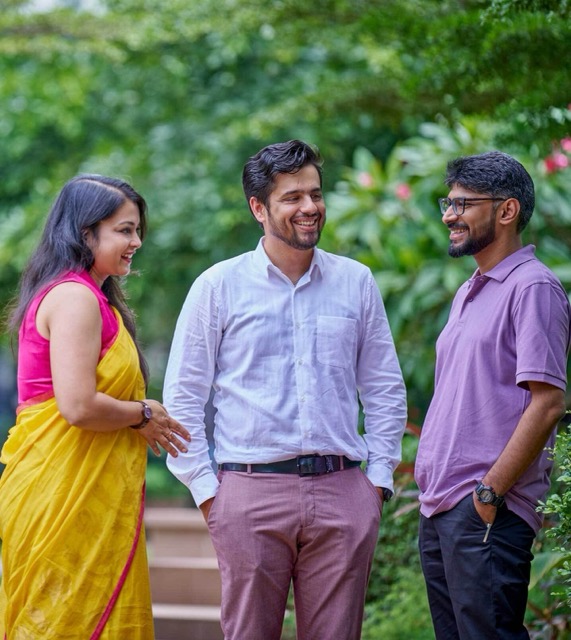 bp employees outdoors talking together, highlighting diversity, collaboration, and workplace culture.