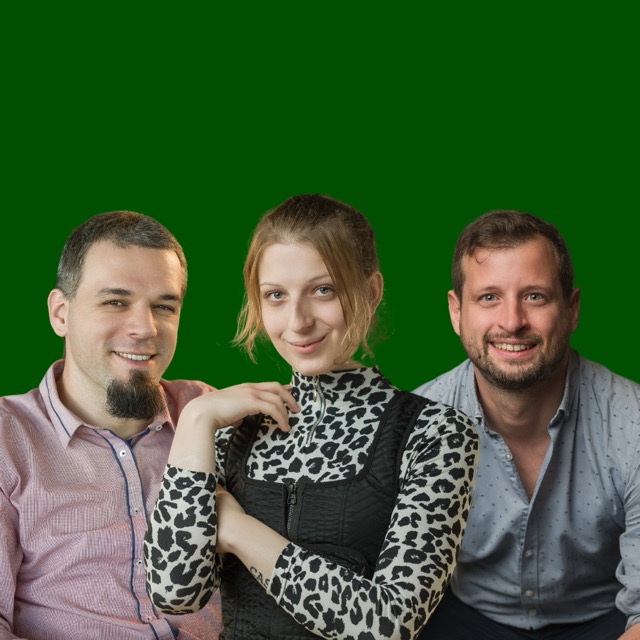 hree colleagues posing for a professional team photo with green background.