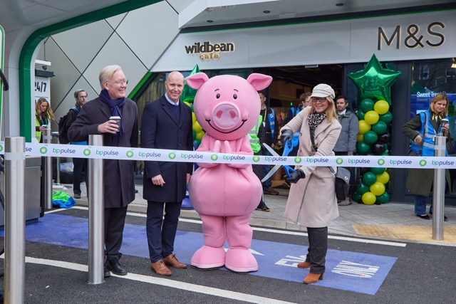 bp and M&S store opening with ribbon cutting and Percy Pig mascot, marking retail partnership.