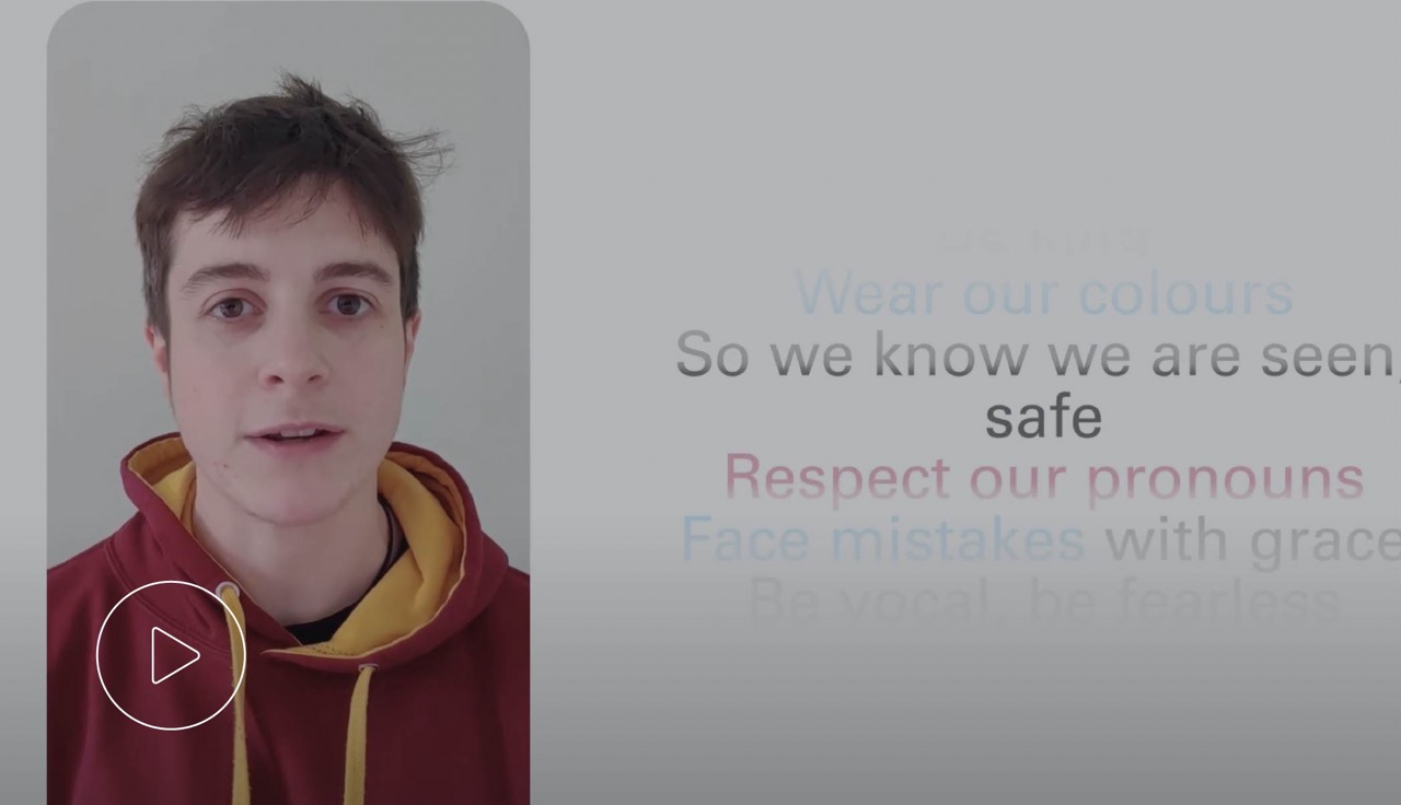 I Stand With Trans graphic showing support for transgender and non-binary inclusion.