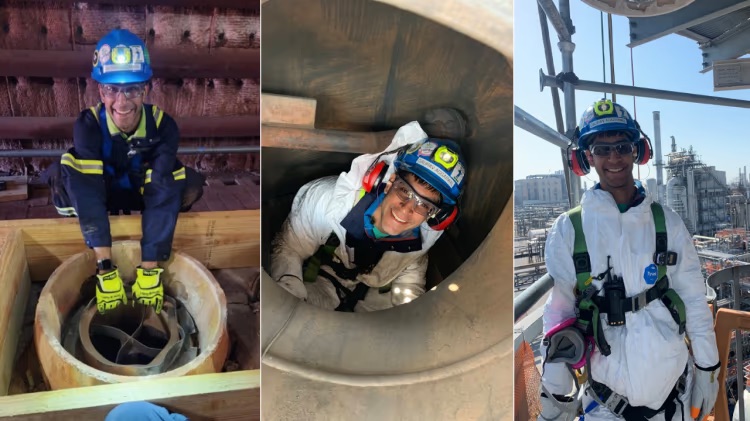 Worker in safety gear performing confined space inspection inside industrial shaft.